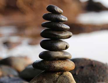 Balanced reiki stones on Lymington beach