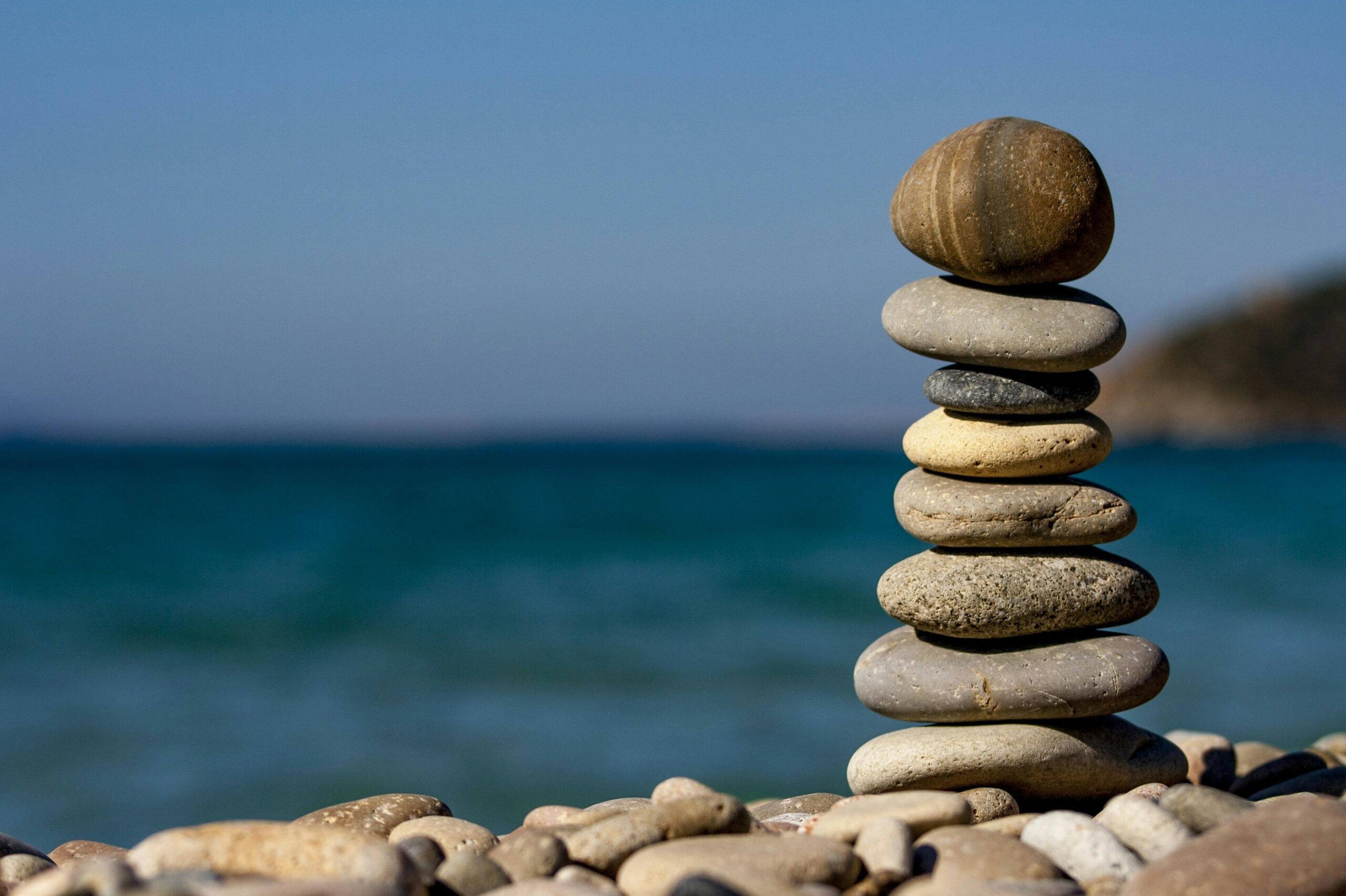 Pile of reiki stones on the beach at Lymington